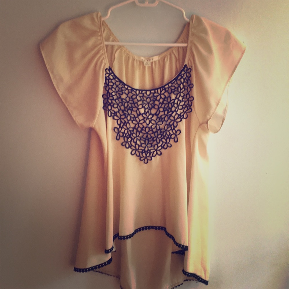 Cream shirt with black flower accents